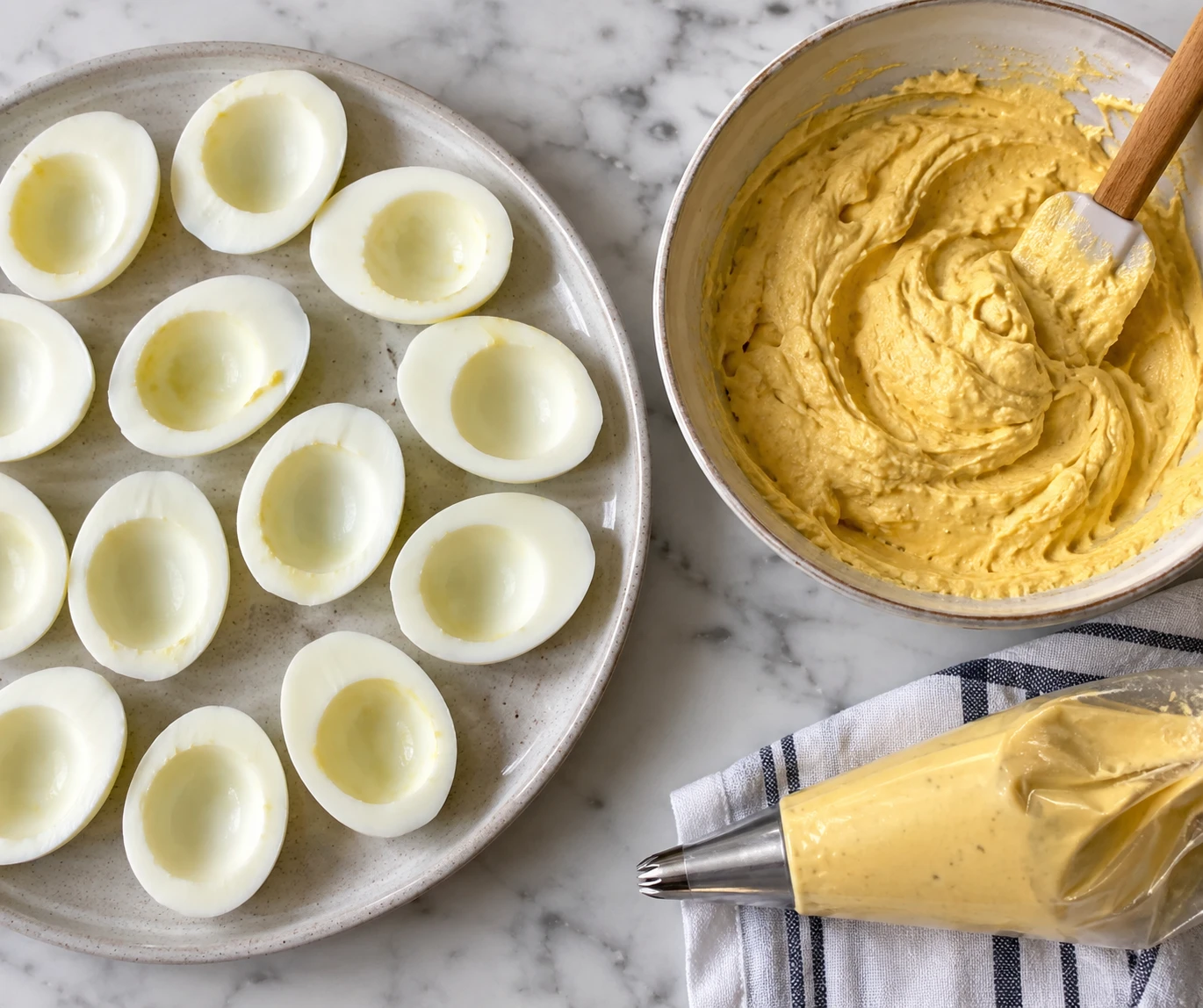 Peeled egg halves sit beside smooth yolk filling and a piping bag.